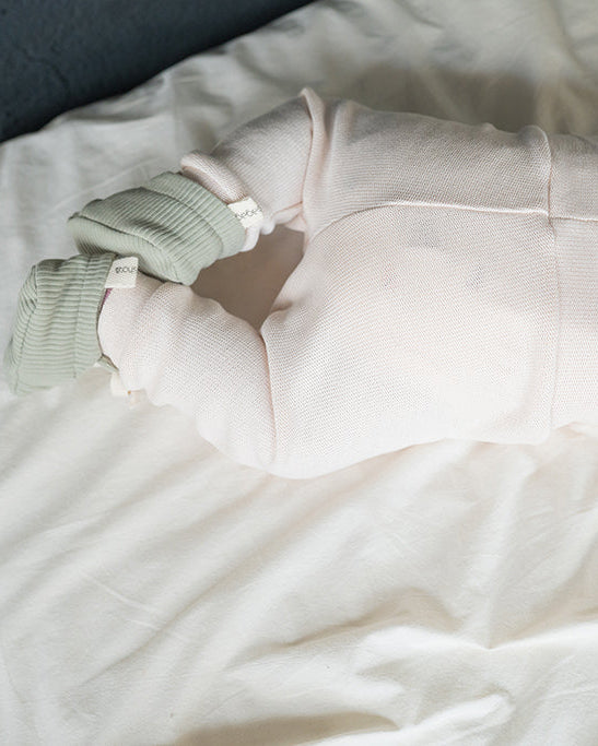 Ecru knitted baby trousers