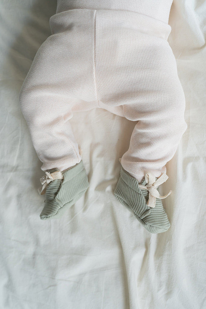 Ecru knitted baby trousers