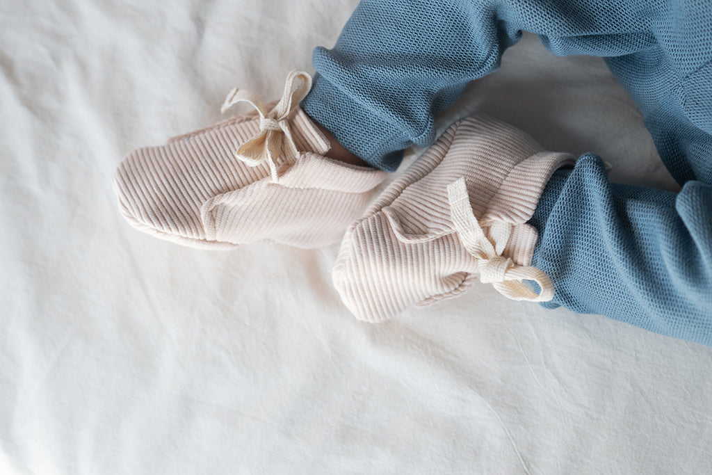 Baby shoes sand