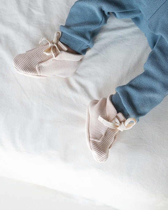 Baby shoes sand