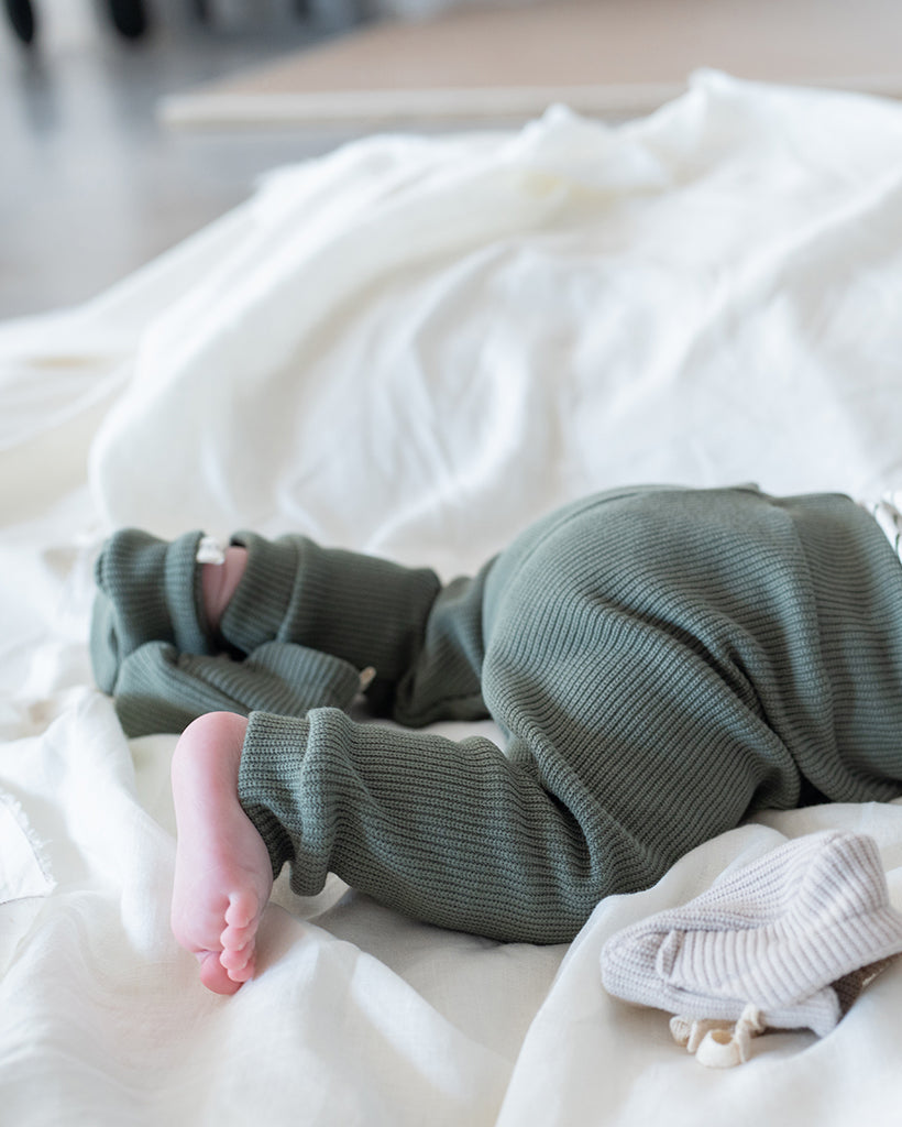 Knitted olive baby trousers