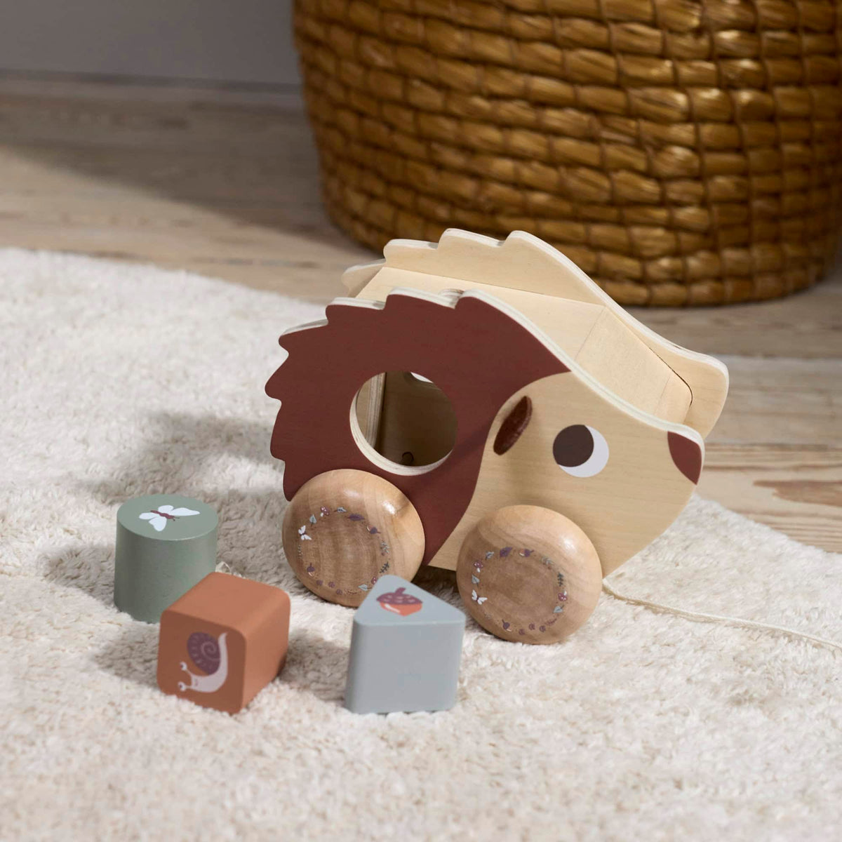 Wooden pull-along sorter toy